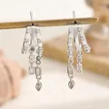 Silver color C-shaped earrings with zircon pavé and multi-shaped tassel charms - Exquisite Gorgeous Long Tassel Dangle Earrings (06/6081)