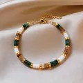 Acrylic beaded geometric stretch bracelet with green stone beads and gold hardware - Colorful