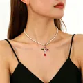 Cross pendant necklace with colorful gems and white pearls on an Asian model - Colored Gemstone Cross Pearl Chain (K-637)