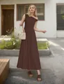 Detail of a dark brown one-shoulder maxi dress with a flowy hem and pleated fabric texture - Brown