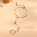 Macro detail of 18k gold slave bracelet with pink heart stones and lobster clasp - Gold Pink Zircon Heart Finger Bracelet (K707)