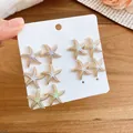 Golden starfish stud earrings set in purple, blue and green colors on white card - Starfish Shape/Multi-color (31# Silver Earring Post)
