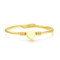 Elegant gold titanium steel cable bracelet with smooth heart charm and ribbed beads - Heart Pattern Style / Gold