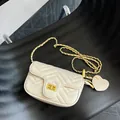Chic beige chevron quilted chain crossbody bag with golden hardware and heart charm - White