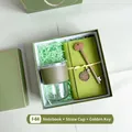 Green business gift set featuring a leather-wrapped glass cup, notebook, and gold key - Bamboo Glass Cup Notebook Key Pen (FA-09)