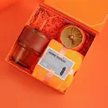 Orange business gift set including a coffee cup with leather sleeve and a persimmon jar - Amber Cup Towel Persimmon Decor (PA-09)