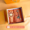 Orange business gift set featuring a portable crown fan, notebook, and key-shaped pen - Orange Fan Notebook Key Pen (PA-18)