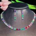 Macro detail of rainbow zircon jewelry set featuring rectangle cut colorful stones - Necklace Earrings / Silver
