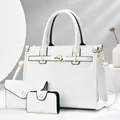 Detailed view of white crocodile pattern three-piece bag set with golden hardware - 29x14x21 / White