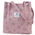 Pink corduroy tote bag featuring black smiley face patterns and a square label patch - Dusty Pink Smiley