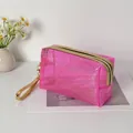 Sparkly pink PVC glitter cosmetic bag organizer with golden zipper and wrist strap for travel - Pink
