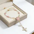Golden rosary bracelet with white pearls, pink enamel cross, and saint medal - Cross Pink