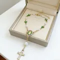 Golden Virgin Mary rosary bracelet with green crosses and white pearls in a gift box - Green Cross