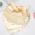 Detailed view of the champagne satin scarf showing its smooth texture and edge finish - Beige / 50*50