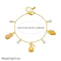 Detailed view of a gold-plated stainless steel charm bracelet with pearls and fruits - B2170