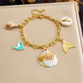 Gold-plated stainless steel ocean theme charm bracelet with dolphin and shell pendants - Dolphin Fishtail Ocean Style (B2163)