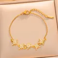 Elegant gold-plated eight-point star bracelet with micro-pave cubic zirconia details. - Gold Star Bracelet