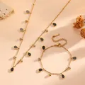 Detail view of gold titanium steel jewelry set with black water-drop pendants and gems. - Black Waterdrop Set (D204+T801) / Jewelry Set