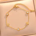 Close-up of gold-plated titanium steel bracelet with zircon flowers and circles - 734 Gold Bracelet / Gold