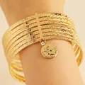 Vintage gold alloy 10-piece bracelet set featuring embossed stars and coin charm - 32 KC Gold A-1453 (7-Piece Set)