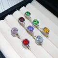 Close-up view of multiple colorful square crystal open rings in a velvet display box. - Square Rhinestone Style (HR3417) / 8-piece Set / Silver