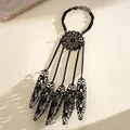 Detailed shot of black gothic filigree hand chain with claw finger sleeves - Mandala Hollow Style / Gunmetal