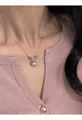 Elegant French style pearl pendant necklace worn on a delicate silver clavicle chain - Style 28