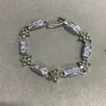 Elegant silver-tone bracelet featuring yellow zircon flowers and square stones with buckle - Silver-Green