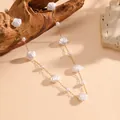 Close-up of minimalist white shell and pearl necklace on a delicate gold chain. - Gold White Shell Necklace (C713)