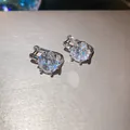Macro view of exquisite silver stud earrings with brilliant round cut zircon stones - Round Single Stone Hoop / Silver