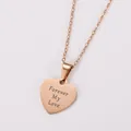 Close-up view of a rose gold heart pendant featuring a "Forever My Love" cursive engraving. - Forever My Love Engraved / Rose Gold