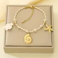 Summer ocean themed cotton rope bracelet featuring gold shell and starfish charms - Ocean Theme - Sea Turtle Shell Starfish (KB207965-SXSJ) / Cream