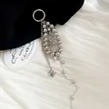Detailed macro view of a stylish silver beaded keychain with heart and star charms. - Star Heart Silver Bead Chain / Silver