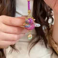 Exquisite Maneki-neko lucky cat pendant with purple embroidery and gold lucky charm - Keychain / Purple Prosperity
