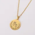 Detailed macro view of the 'Forever in My Heart' engraving on a gold footprint pendant - Sunflower Round Plate Necklace / Gold