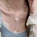 Elegant Korean style necklace featuring white pearls and a textured flower pendant - Silver Multicolor