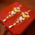 Vintage teardrop earrings with purple gems and white pearls in elegant gold finish. - Gold Pearl Crystal Tassel Ear Buckle