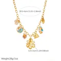 Macro view of gold-plated marine life pendant necklace featuring octopus and shell charms - N4330 Style