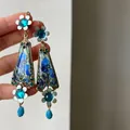 Detailed view of vintage blue resin flower earrings with crystal accents and teardrop beads. - Vintage Palace Style Flower Ear Hook / Blue