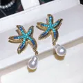 Close-up macro view of vintage starfish earrings with blue rhinestones and pearl drops - Starfish Drop Earrings / 3# Gold-Blue