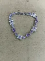 Elegant silver flower bracelet with sparkling purple teardrop and round stones - Purple