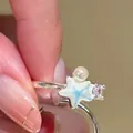 Detailed close-up of adjustable silver ring featuring a blue starfish and pearl accent - Starfish Style (HR3475-1) / Silver-Blue