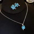 Blue cat's eye stone four-leaf clover necklace and earrings jewelry set in silver finish. - Necklace And Earrings Set / Blue
