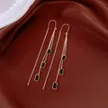 Macro shot of elegant 14k gold plated threader earrings with black geometric accents. - Square Geometric Ear Thread / Gold