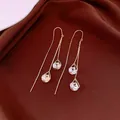 Detailed macro view of 14K gold plated teardrop ear threads with number 1314 engraving - Waterdrop Number Ear Thread / Gold