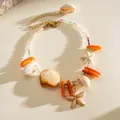 Collana estiva con conchiglie, stelle marine e perline di cristallo colorate boho. - Bracciale / Oro-Multicolore
