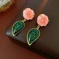 Vintage earrings featuring pink resin roses and sparkling green teardrop pendants. - Pink Green Rose Drop Style (HE13116)