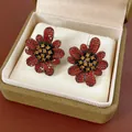 Vintage red and yellow zircon flower stud earrings displayed in a luxury jewelry box - Black Red Contrast Flower Style (HE13425)