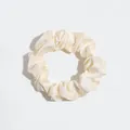 Minimalist solid cream silk-like hair scrunchie featuring a soft pleated design - Scrunchie / Beige