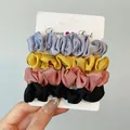 Set of four satin scrunchies in blue yellow pink and black on display card - Satin Scrunchies Set / Four Colors Combination